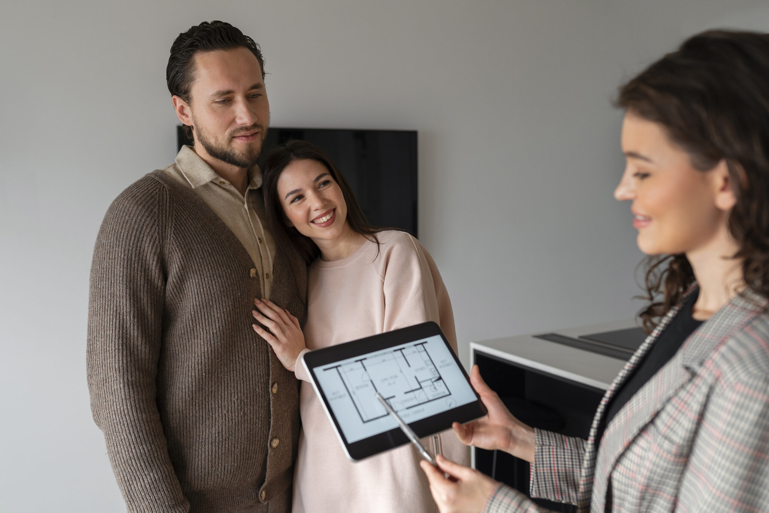 side-view-real-estate-agent-holding-tablet