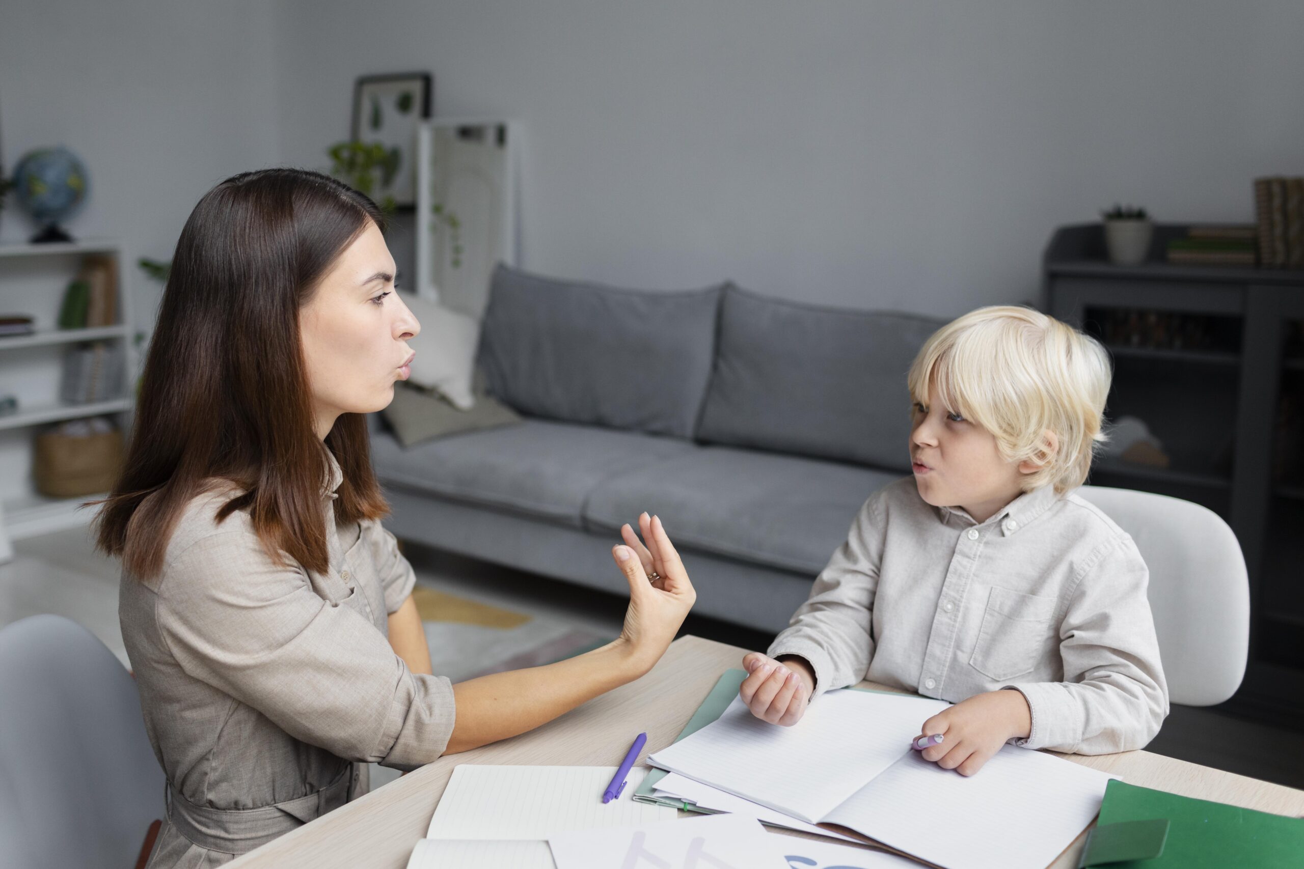young-woman-doing-speech-therapy-with-little-boy(1)