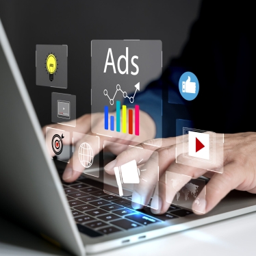 Digital marketing concept, Young man using laptop with Ads dashb